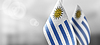 Kleine Nationalflaggen von Uruguay auf leicht verschwommen | Stock Foto