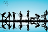 Vector clipart: Group of children silhouettes playing