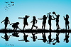 Vector clipart: Group of children silhouettes playing outdoor