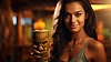 Photo 300 DPI: Girl with tiki cocktail. Blurred beach bar on