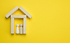 ID 7182568 | Wooden miniature house on yellow background. concep | High resolution stock photo ID 7182568 | Wooden miniature house on yellow background. concep | High resolution stock photo | CLIPARTO