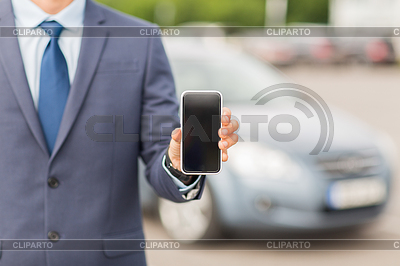 Hombre de negocios con el teléfono inteligente y el coche | Foto de alta resolución |ID 5372163