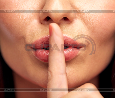 Young woman holding finger on lips | High resolution stock photo |ID 5453484
