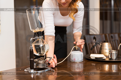 Woman with siphon coffee maker and pot | High resolution stock photo |ID 5579440
